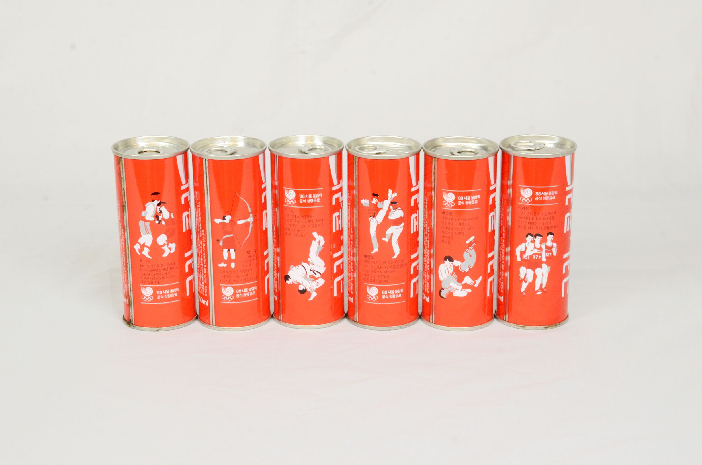 A set of 6 Coca-Cola cans from 1988 Olympics