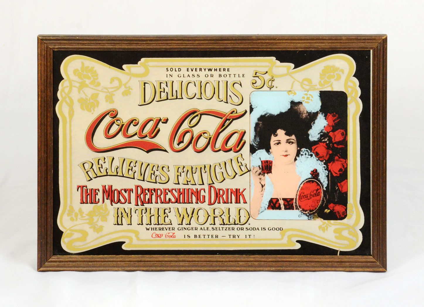 Advertisement on mirror 
"Delicious Coca-Cola"
