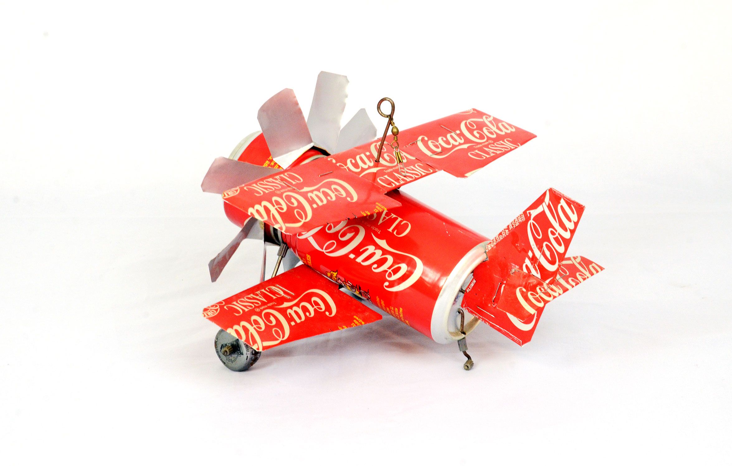 Hangable biplane toy made from Coca-Cola cans
