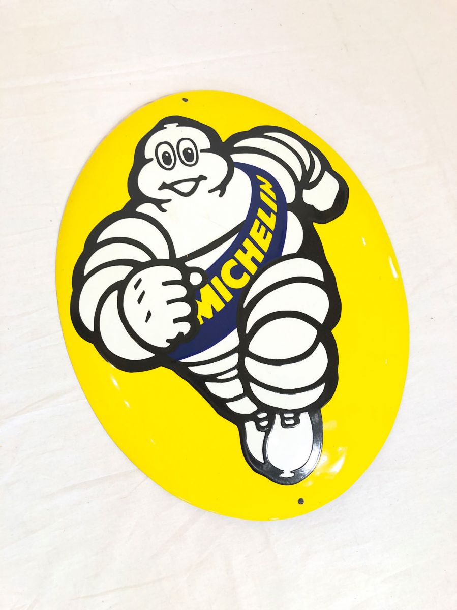 Oval enamel sign with Michelin man logo