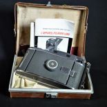Polaroid Land Camera in leather box with descriptions