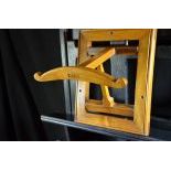 Practical foldable coat hanger for wall mounting made of walnut wood. Height  43 cm.